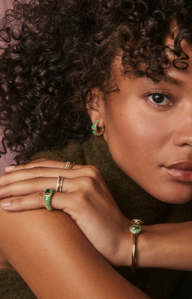 Image of two women wearing Kendra Scott jewelry